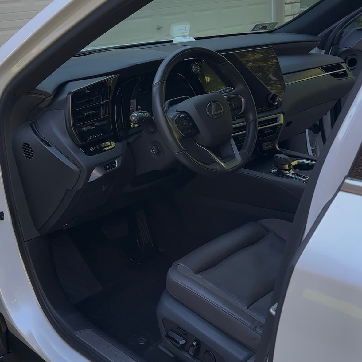Clean and detailed car interior showing spotless seats and dashboard